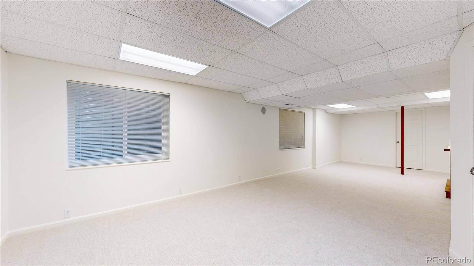 12237 Cook Court Thornton, CO 80241 - Photo 28 of 48 a view of an empty room with a window