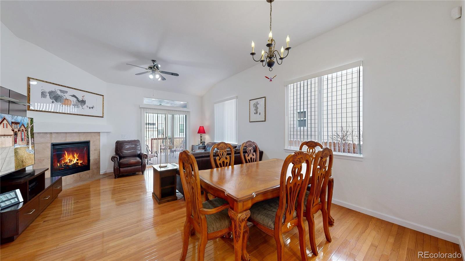 12237 Cook Court Thornton, CO 80241 - Photo 5 of 48 a view of a dining room with furniture window and wooden floor