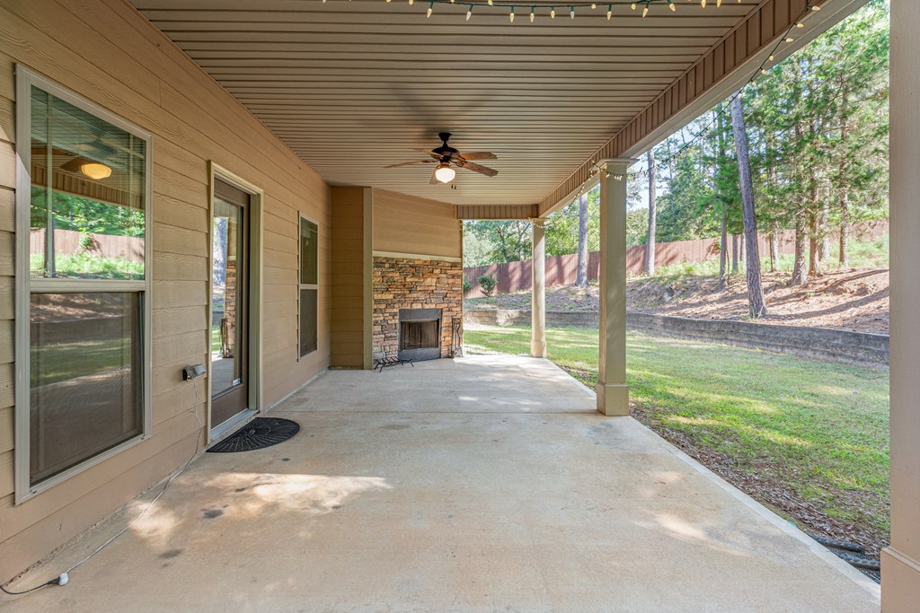 10230 Whitesville Road Fortson, GA 31808 - Photo 46 of 53 Covered patio with fireplace
