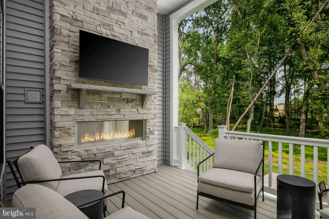 a view of a chair and table in the balcony