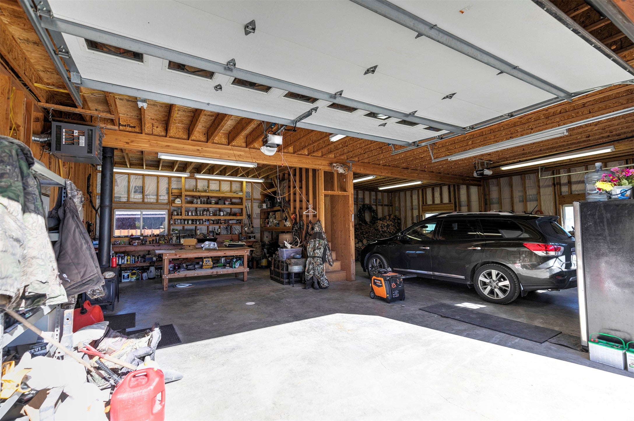 203 Hart Bench Road Darby, MT 59829 - Photo 42 of 56 Generous in size, the garage offers room for vehicles, projects, and all your hobbies, making it as functional as it is spacious.