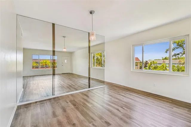 a view of a kitchen with a stove cabinets and wooden floor