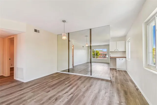 a kitchen view with stainless steel appliances a sink and a window