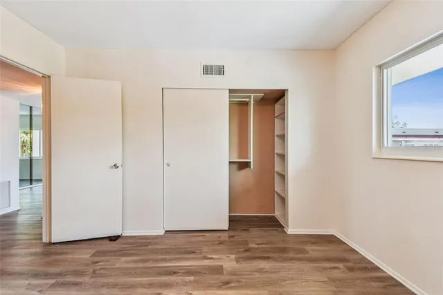 a view of a bathroom with wooden floor