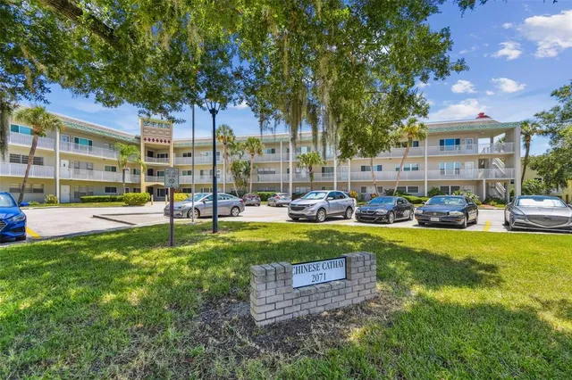 a view of room with window and wooden floor