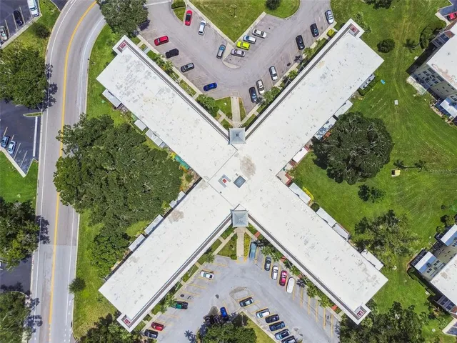 an aerial view of residential houses with city view