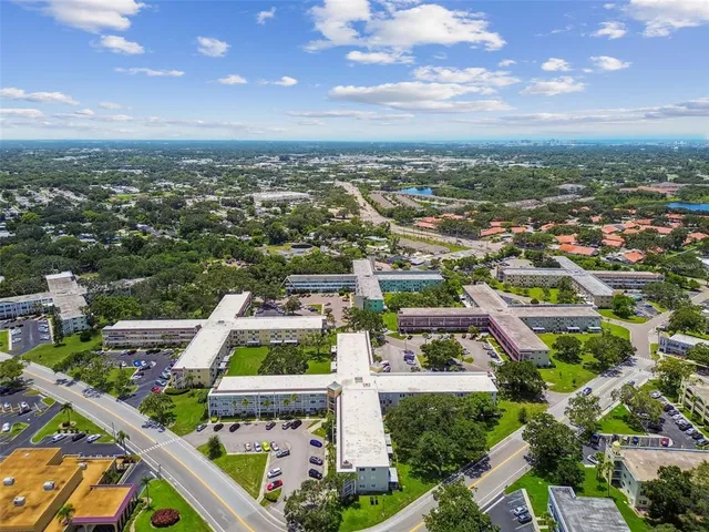 a view of a city that has lawn chairs and a table