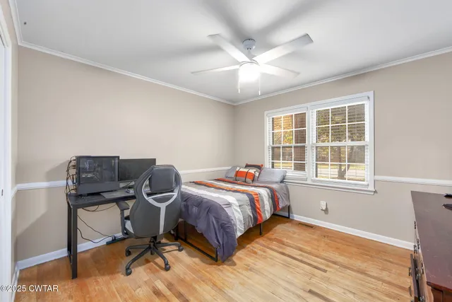 a bedroom with a workspace