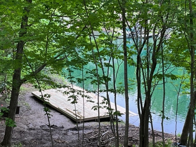 13 Pinetree Court Putnam, IL 61560 - Photo 2 of 5 a view of a chairs and table in the backyard