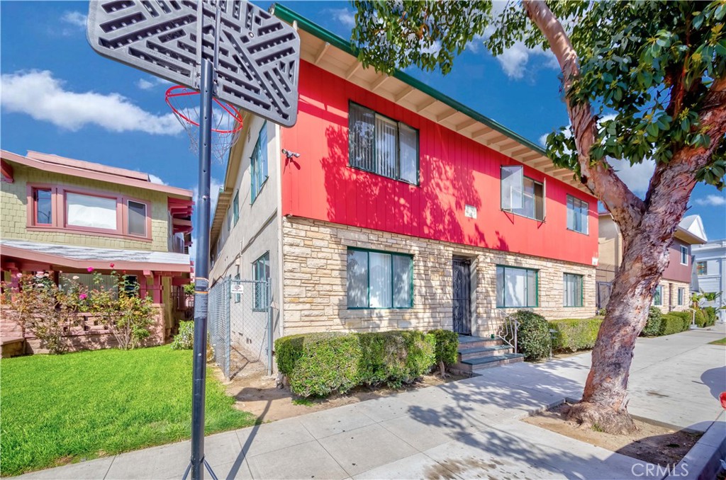 a view of a building with a yard
