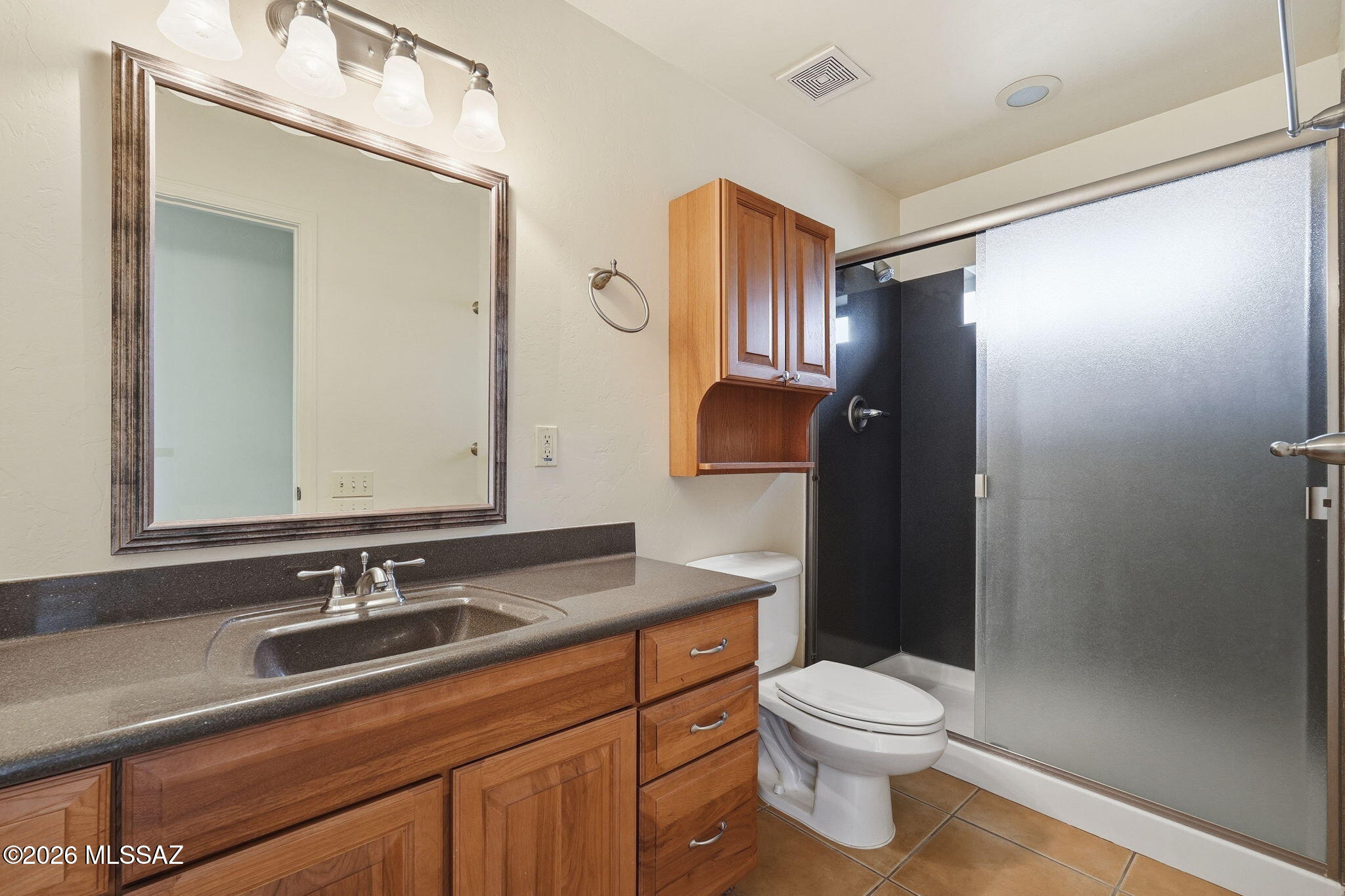 1125 East Kleindale Road Tucson, AZ 85719 - Photo 46 of 49 a bathroom with a sink a toilet and shower