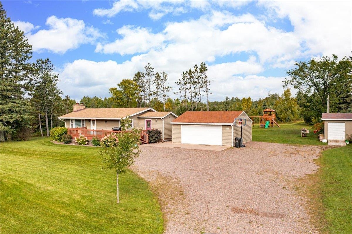 645 Stanley Road Two Harbors, MN 55616 - Photo 26 of 26 Ranch-style house featuring a front yard, an outdoor structure, a playground, and a garage
