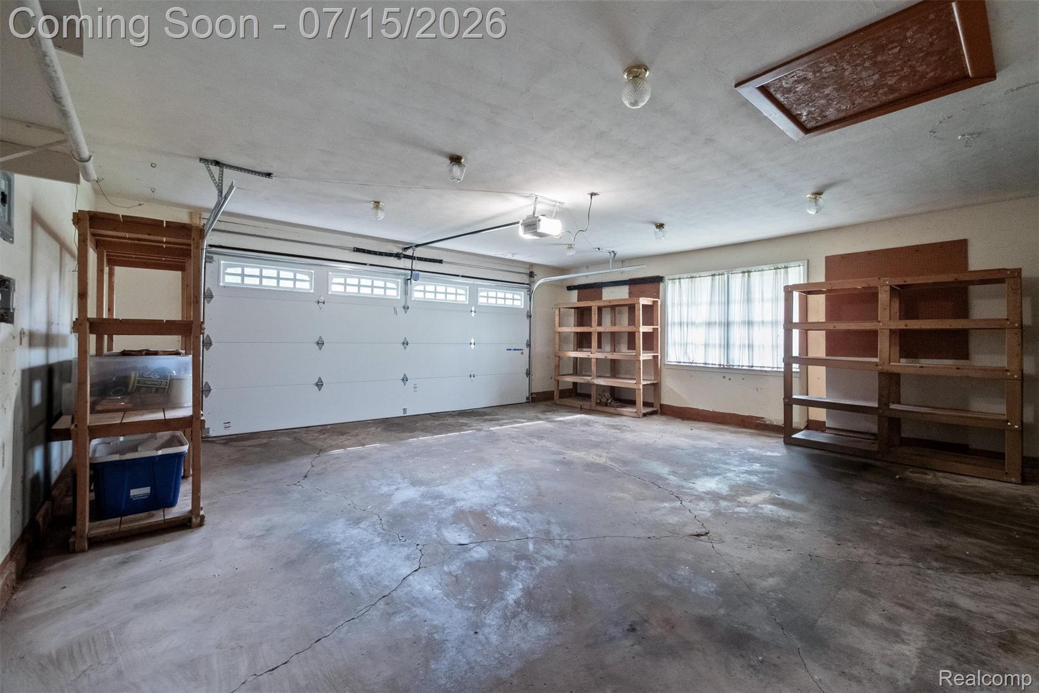 1151 Peveril Road Bloomfield Hills, MI 48304 - Photo 33 of 39 2.5 car garage with attic access and several wooden storage units