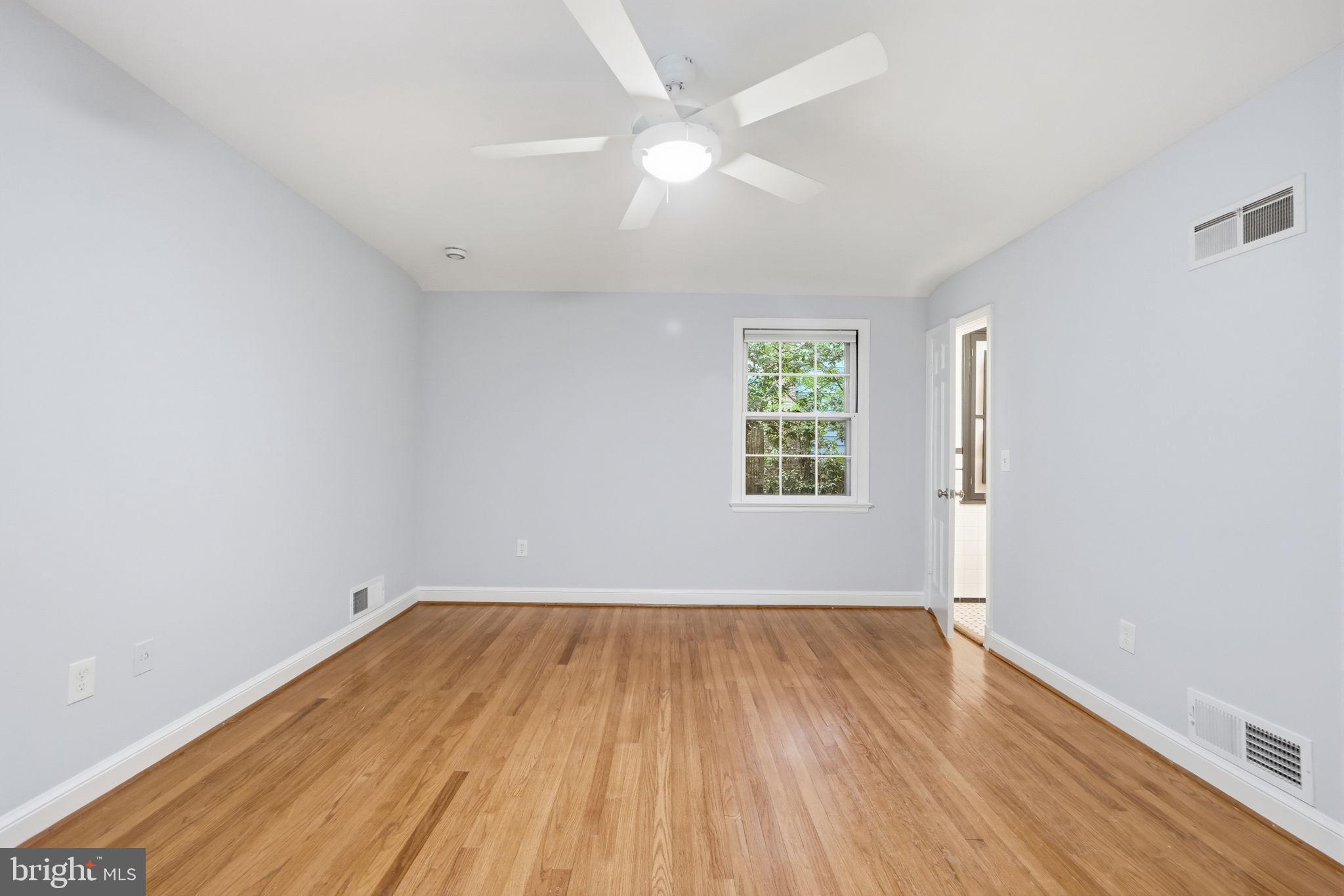 5910 Overlea Road Bethesda, MD 20816 - Photo 22 of 56 wooden floor in an empty room with a window