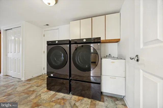 a yard with trees in the background