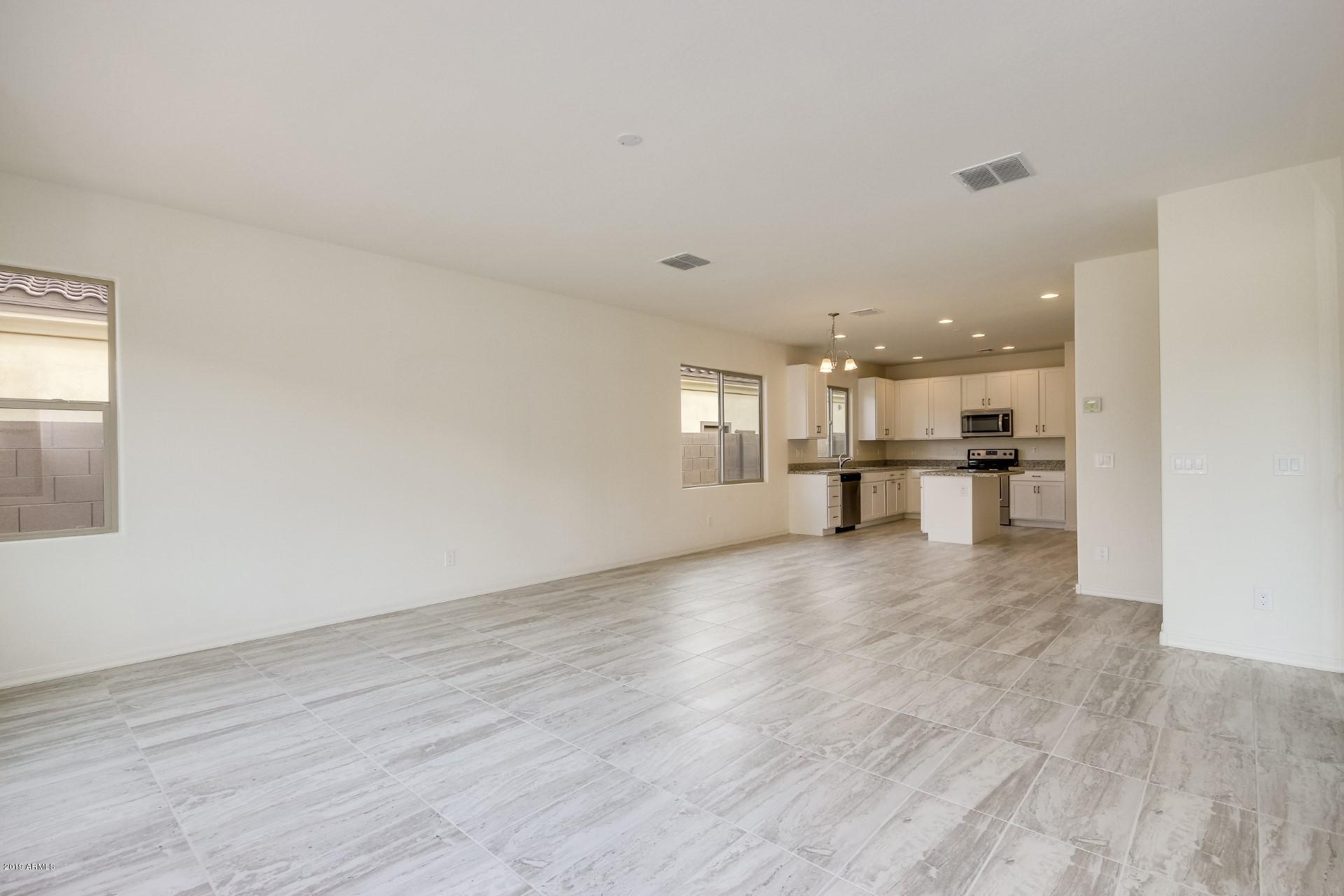 20534 West Alsap Road Buckeye, AZ 85396 - Photo 11 of 20 Great Room, Nook, and Kitchen