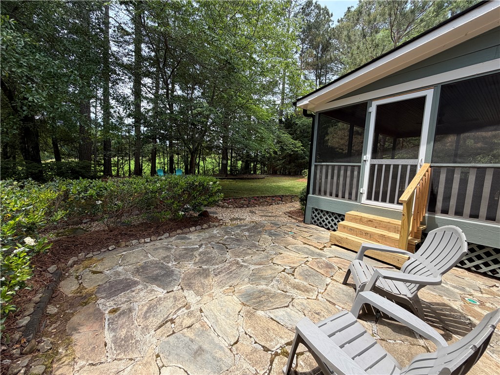 232 Hunters Trail Walhalla, SC 29691 - Photo 27 of 38 This tranquil outdoor space features a natural stone patio and a screened-in porch.