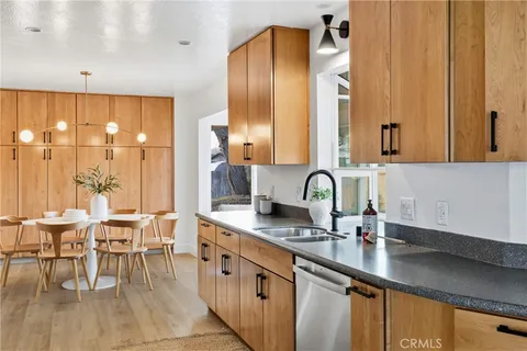 a kitchen with stainless steel appliances a sink and cabinets
