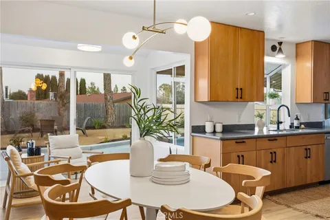a kitchen with a table and chairs in it