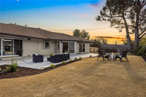 a house view with a sitting space and garden