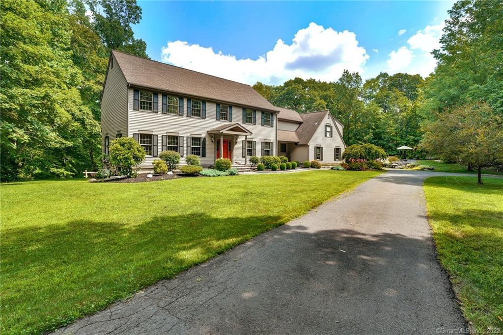 45 Scudder Road Newtown, CT 06470 - Photo 1 of 1 a front view of house with yard and green space