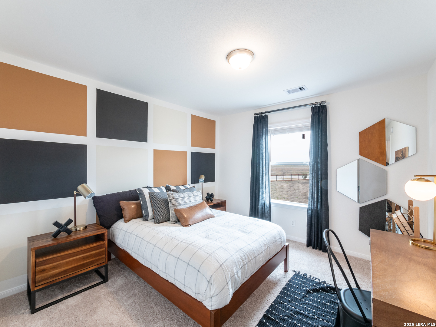 10715 Upwind Turn Converse, TX 78109 - Photo 13 of 17 a bedroom with a bed and wooden floor
