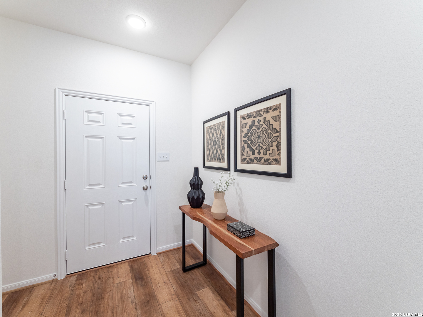 10715 Upwind Turn Converse, TX 78109 - Photo 2 of 17 a view of a hallway with wooden floor