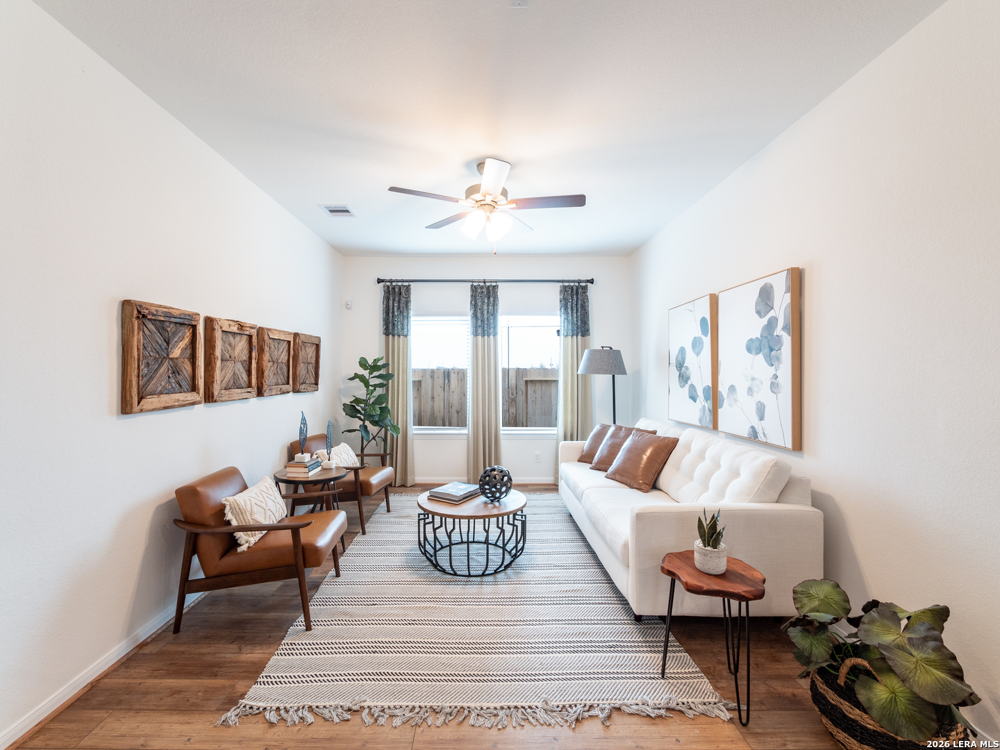 10715 Upwind Turn Converse, TX 78109 - Photo 3 of 17 a living room with furniture and a large window