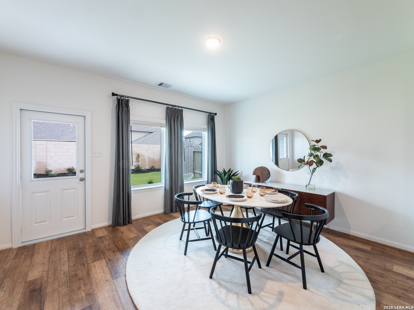 10715 Upwind Turn Converse, TX 78109 - Photo 9 of 17 a dining room with furniture and window