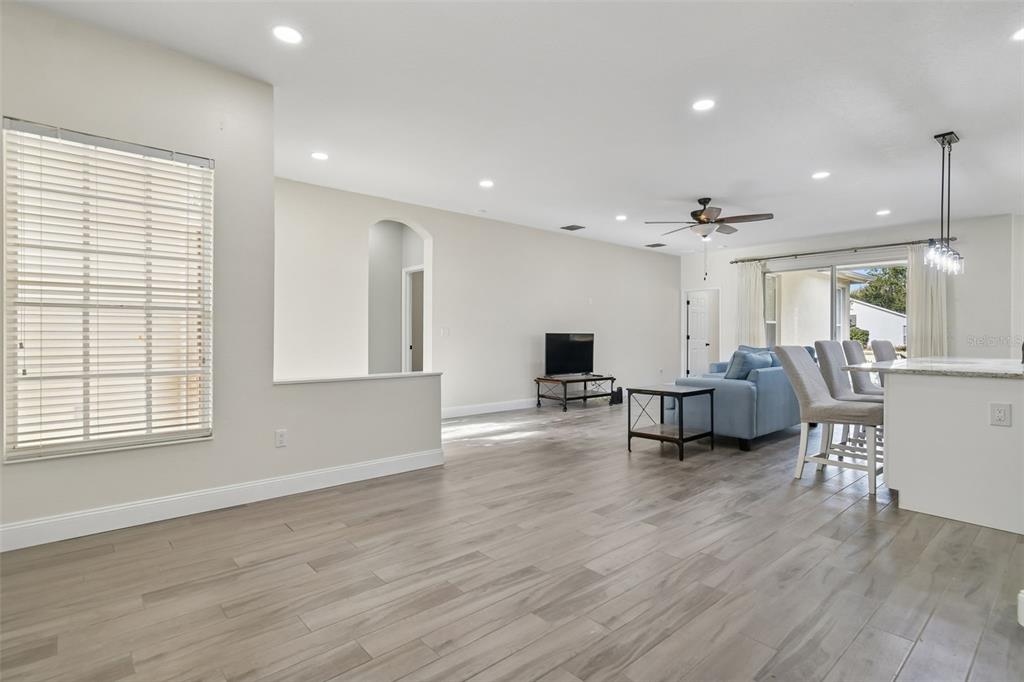 3311 Stonebridge Trail Valrico, FL 33596 - Photo 13 of 33 a living room with furniture and a wooden floor