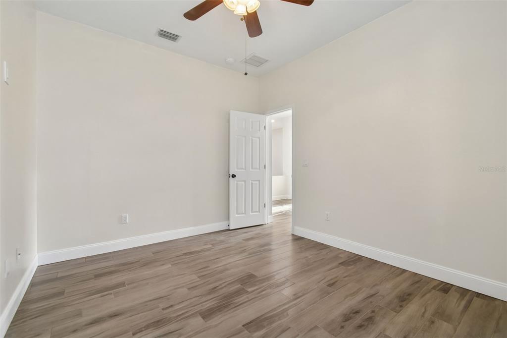 3311 Stonebridge Trail Valrico, FL 33596 - Photo 20 of 33 wooden floor in an empty room