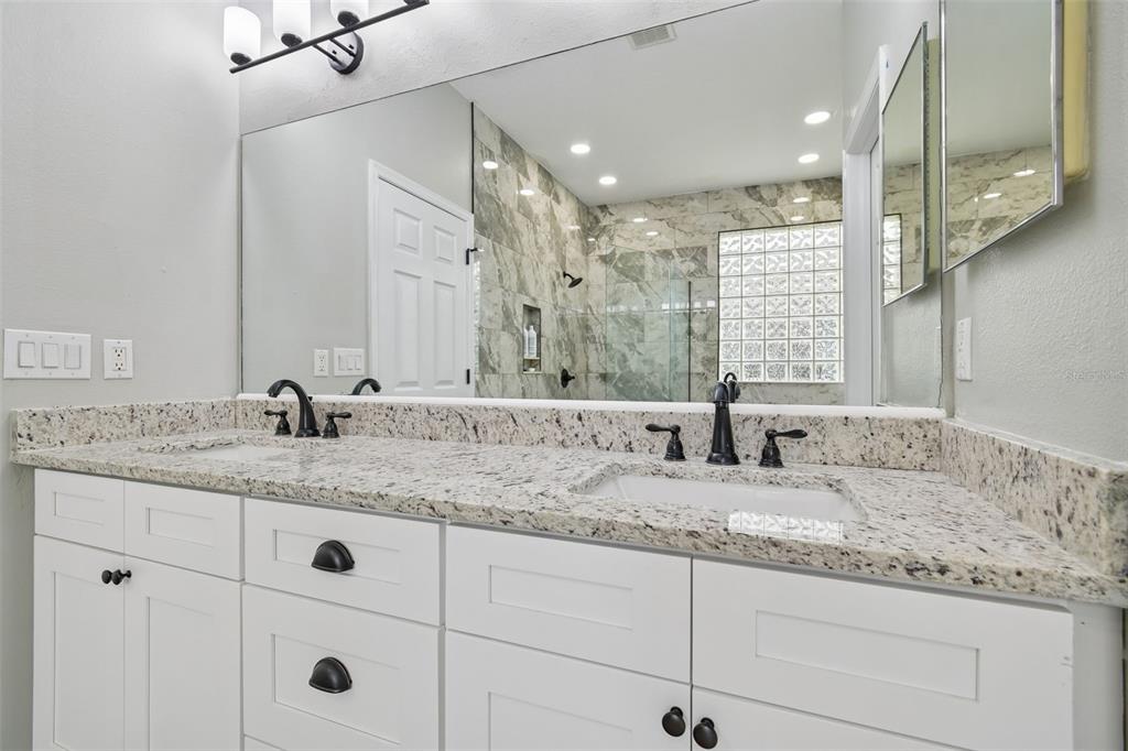 3311 Stonebridge Trail Valrico, FL 33596 - Photo 23 of 33 a bathroom with double sink and a mirror