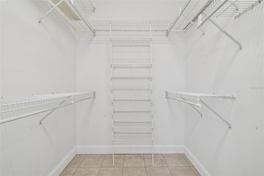 3311 Stonebridge Trail Valrico, FL 33596 - Photo 26 of 33 a view of walk in closet with empty racks
