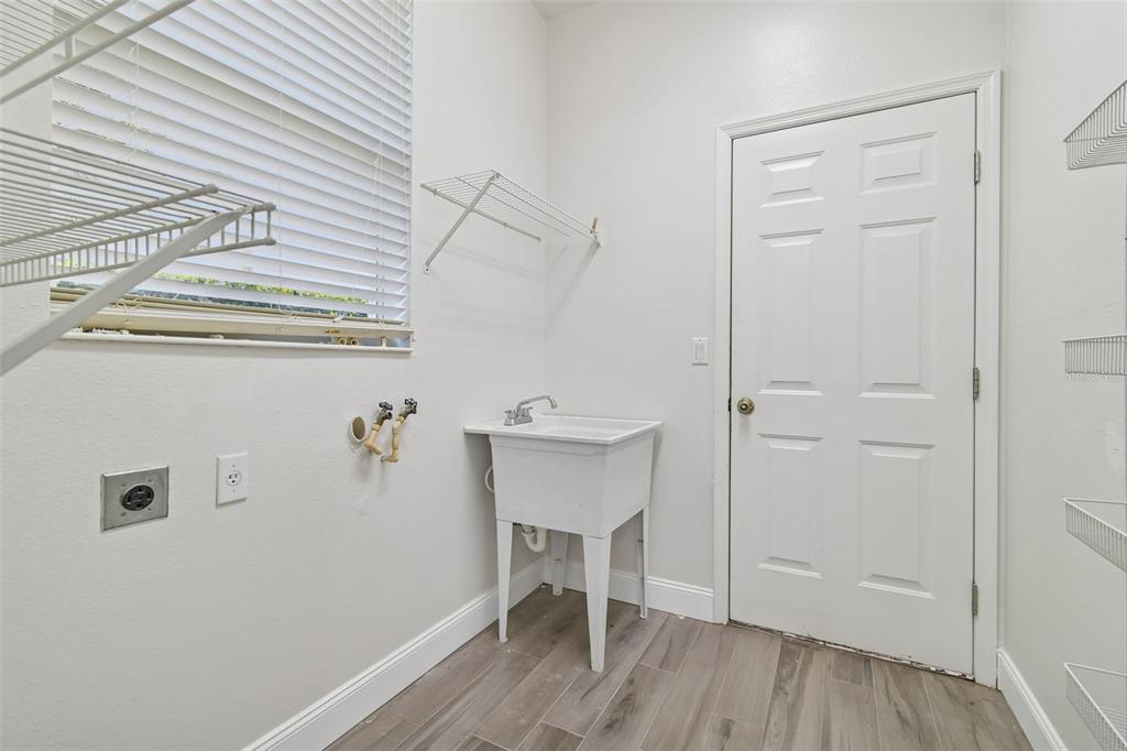 3311 Stonebridge Trail Valrico, FL 33596 - Photo 27 of 33 a view of a hallway with wooden floor and a cabinet