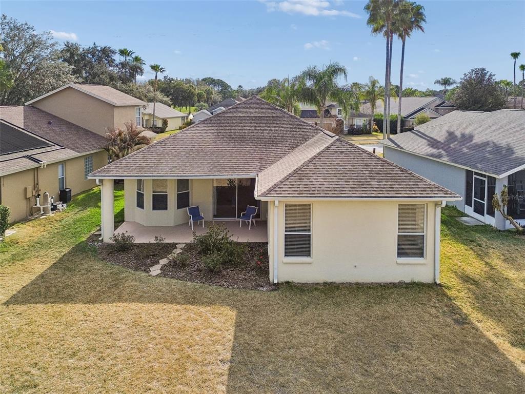 3311 Stonebridge Trail Valrico, FL 33596 - Photo 30 of 33 a view of a house with a backyard and porch