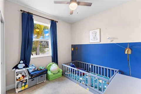 a bedroom with furniture and a window