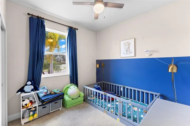 a bedroom with furniture and a window