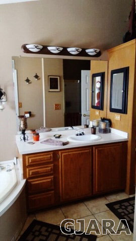 877 R Road Mack, CO 81525 - Photo 8 of 9 a bathroom with a sink and a mirror