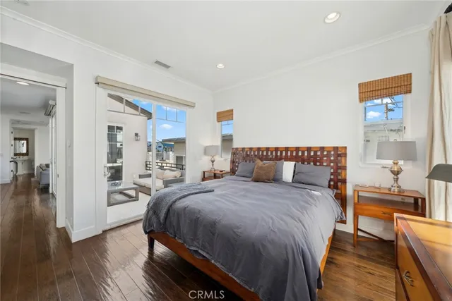 a bedroom with bed and window