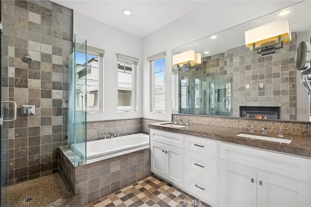 a bedroom with a bed and a large mirror