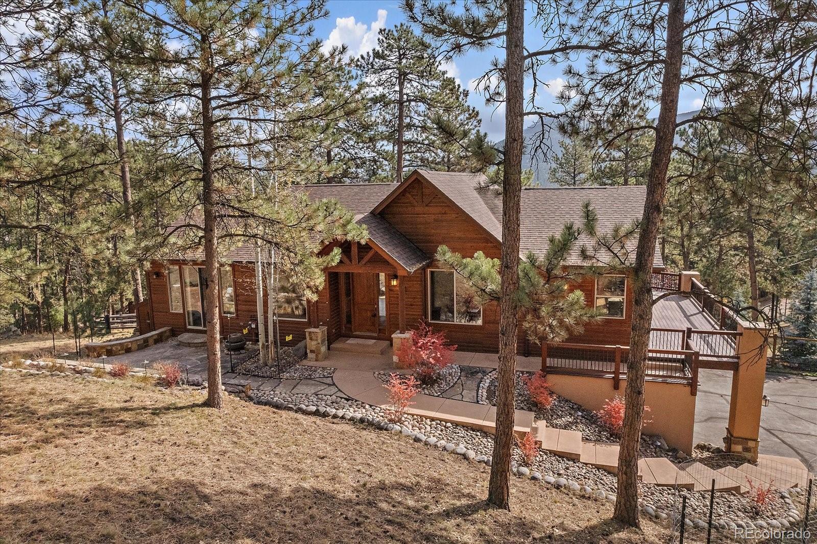 28857 Cedar Circle Evergreen, CO 80439 - Photo 2 of 50 a view of house with a outdoor space