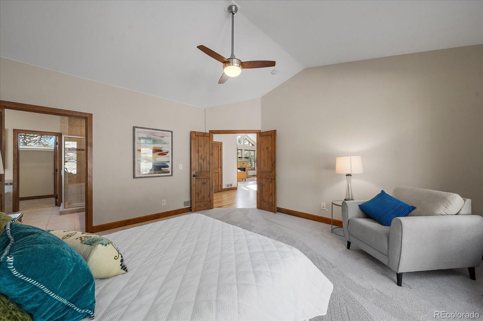 28857 Cedar Circle Evergreen, CO 80439 - Photo 22 of 50 a bedroom with a bed and window