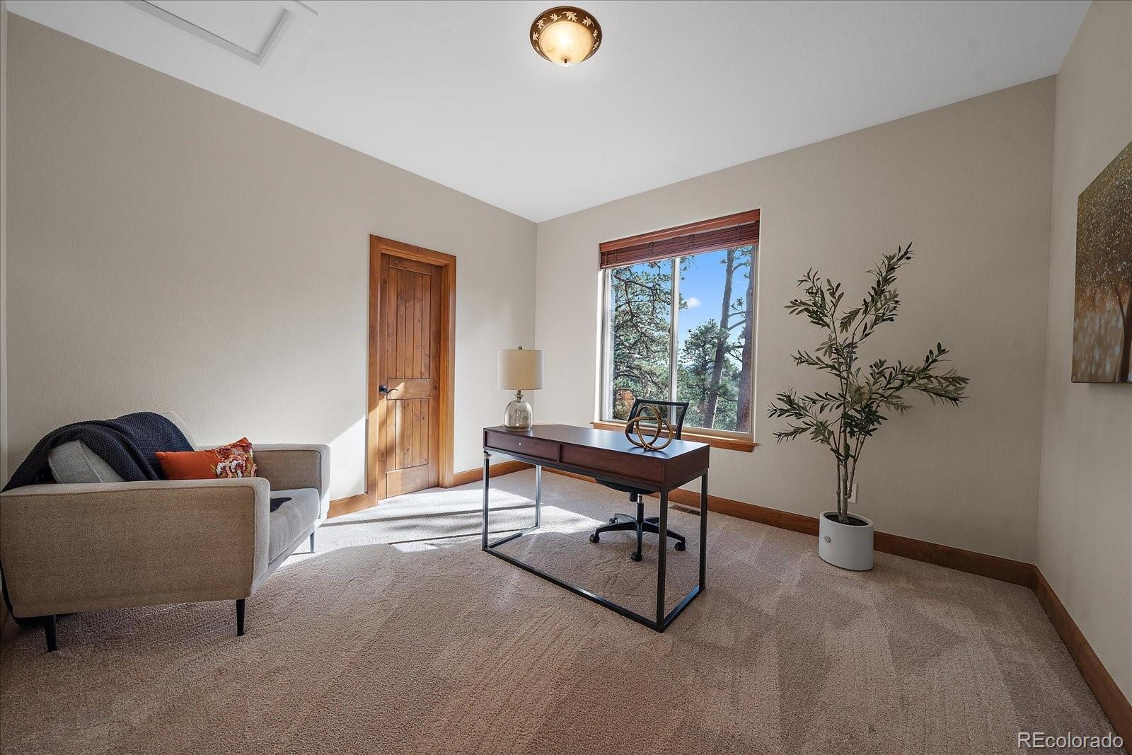 28857 Cedar Circle Evergreen, CO 80439 - Photo 28 of 50 a living room with furniture and a window