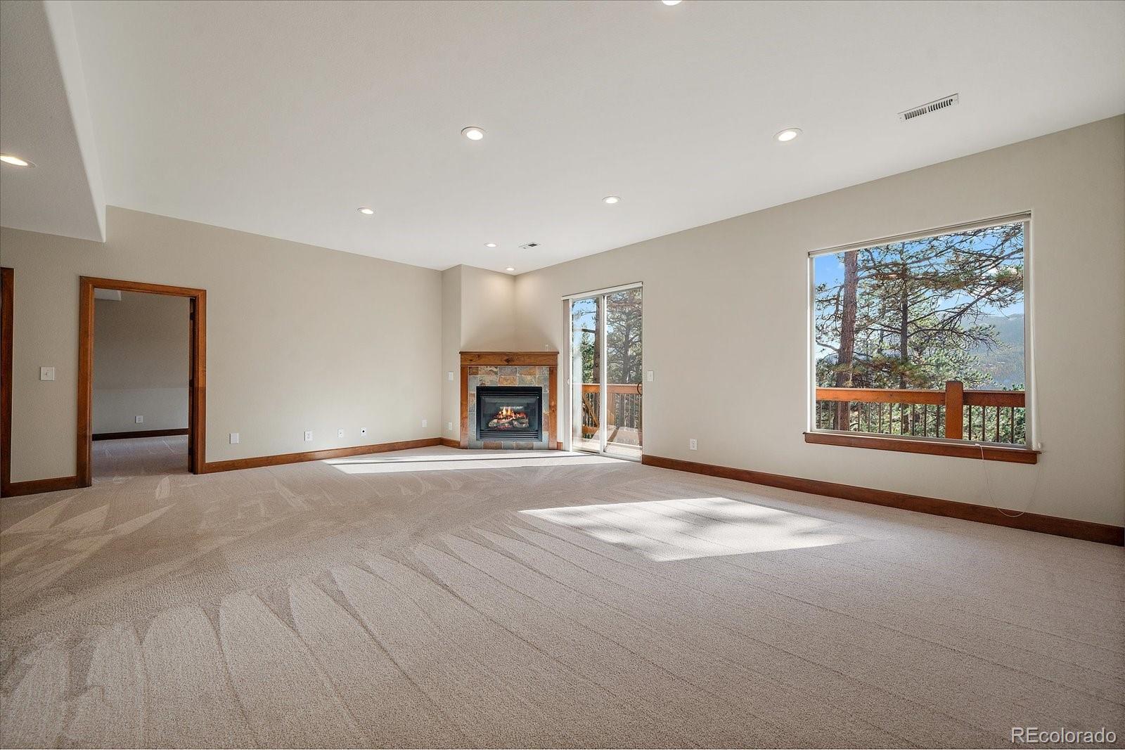 28857 Cedar Circle Evergreen, CO 80439 - Photo 32 of 50 a view of an empty room with a window
