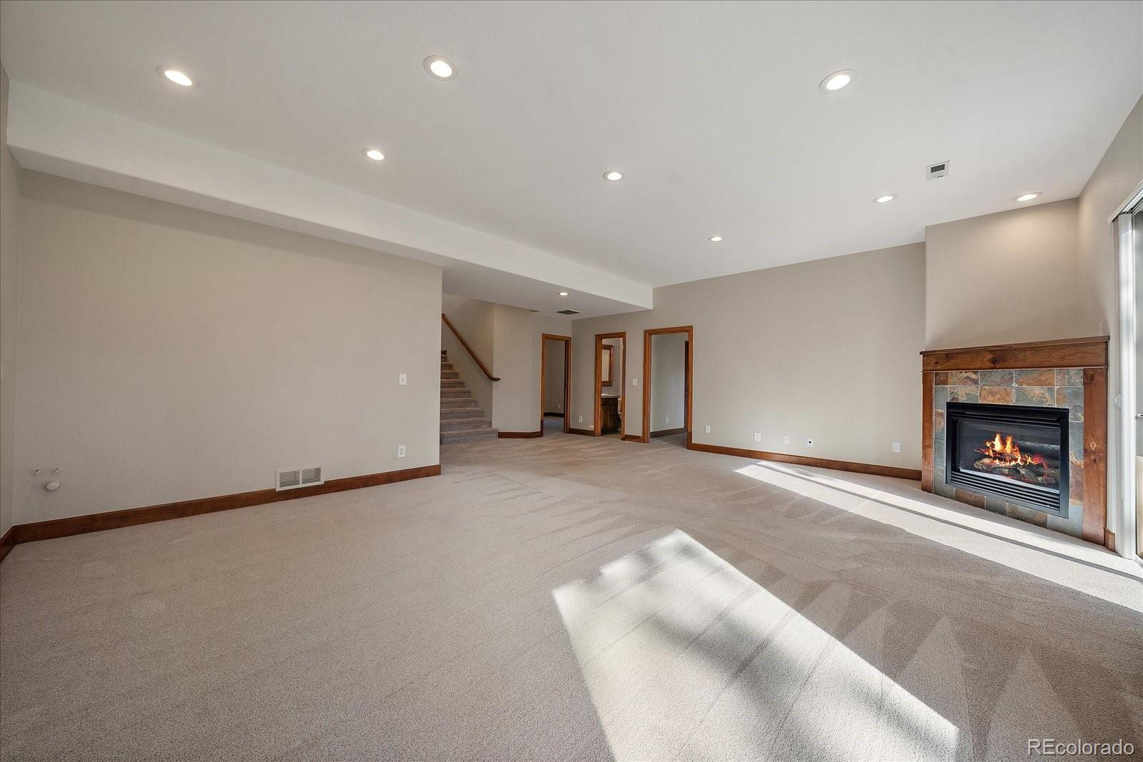 28857 Cedar Circle Evergreen, CO 80439 - Photo 33 of 50 a view of a livingroom with a fireplace