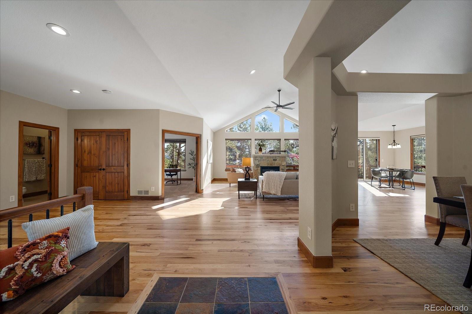 28857 Cedar Circle Evergreen, CO 80439 - Photo 5 of 50 a living room with furniture and a flat screen tv