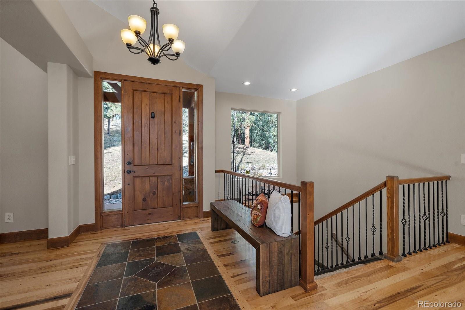 28857 Cedar Circle Evergreen, CO 80439 - Photo 6 of 50 a view of entryway with wooden floor