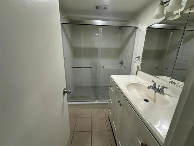 a bathroom with a sink and mirror