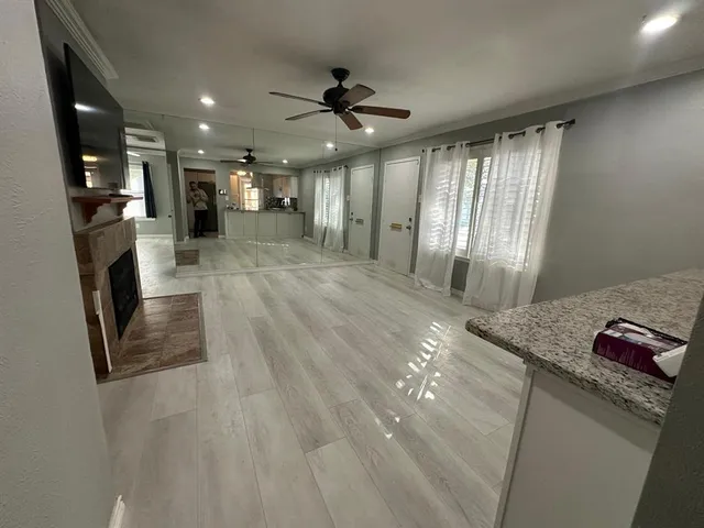 a kitchen with a stove sink and cabinets