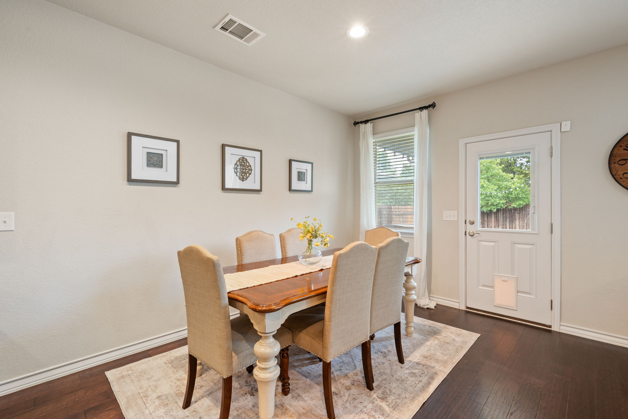 409 Limestone Road Liberty Hill, TX 78642 - Photo 14 of 35 a view of a dining room with furniture and wooden floor